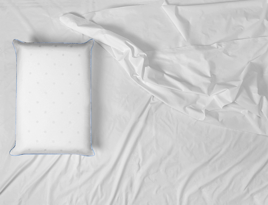 Mediflow Elite Memory Foam water Pillow on a bed