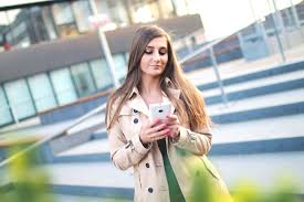 women texting and walking