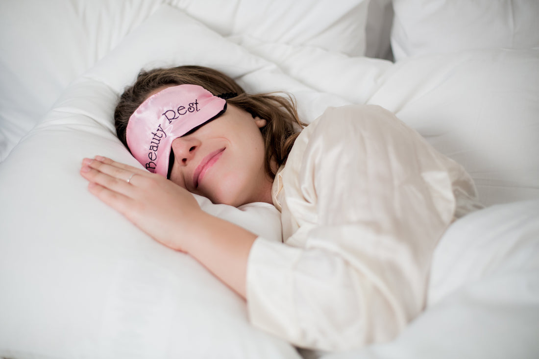 women sleeping with sleep mask on pillow